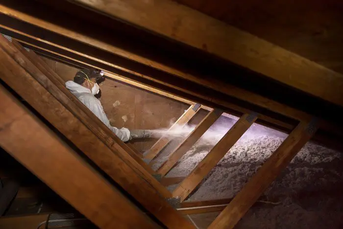 Crawl Pros professional spraying new insulation material after an attic insulation removal