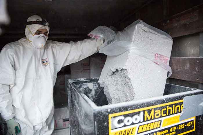 Crawl Pros professional prepping new attic insulation material